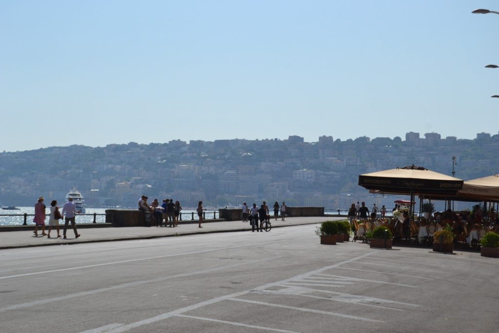 walk along the beautiful seafront promenade in Naples 